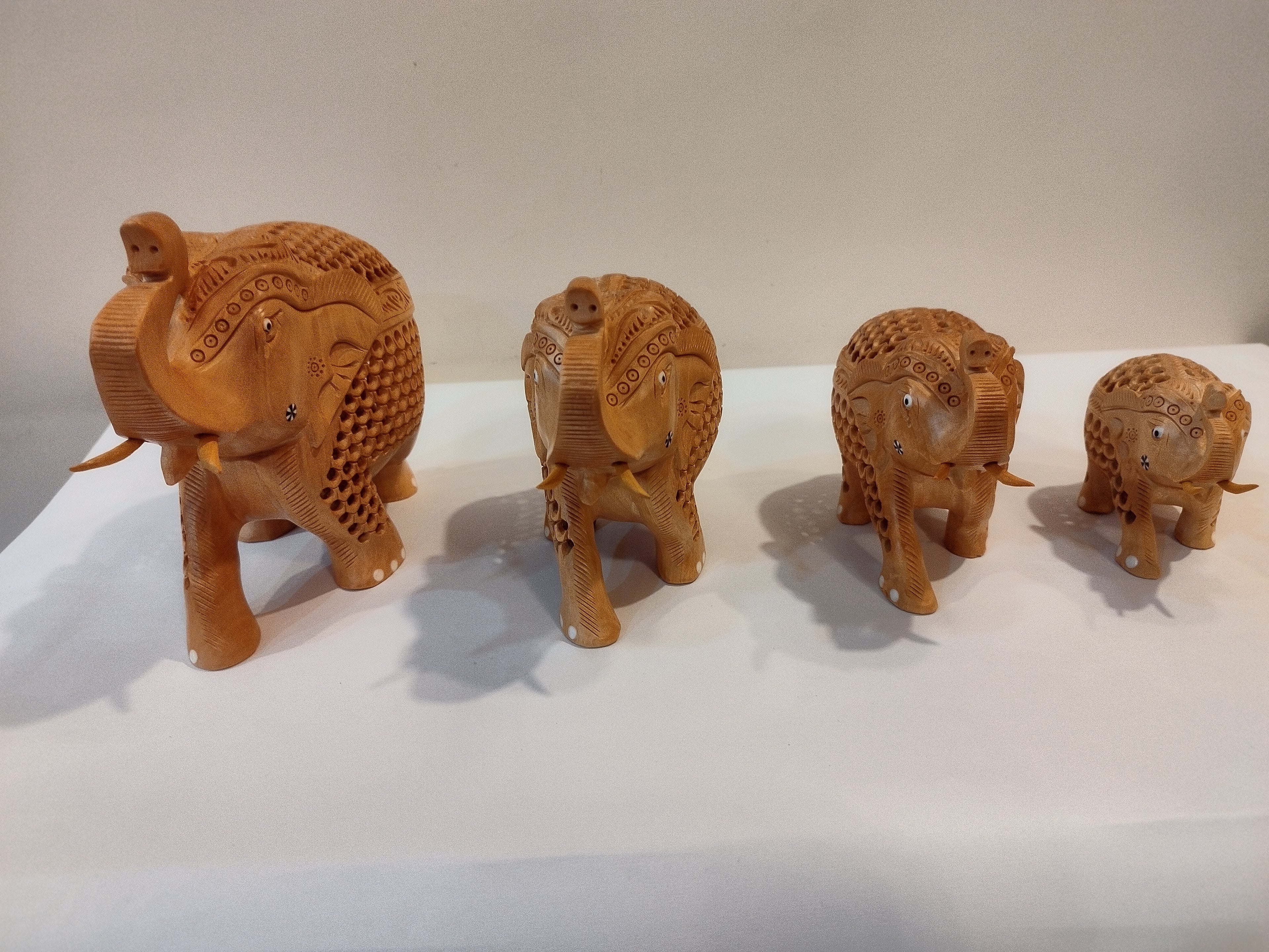Hand Carved Kadam Wood Elephant Family ( Four elephants of the height 3,4,5 and 6 inches )- Spiritual Decor