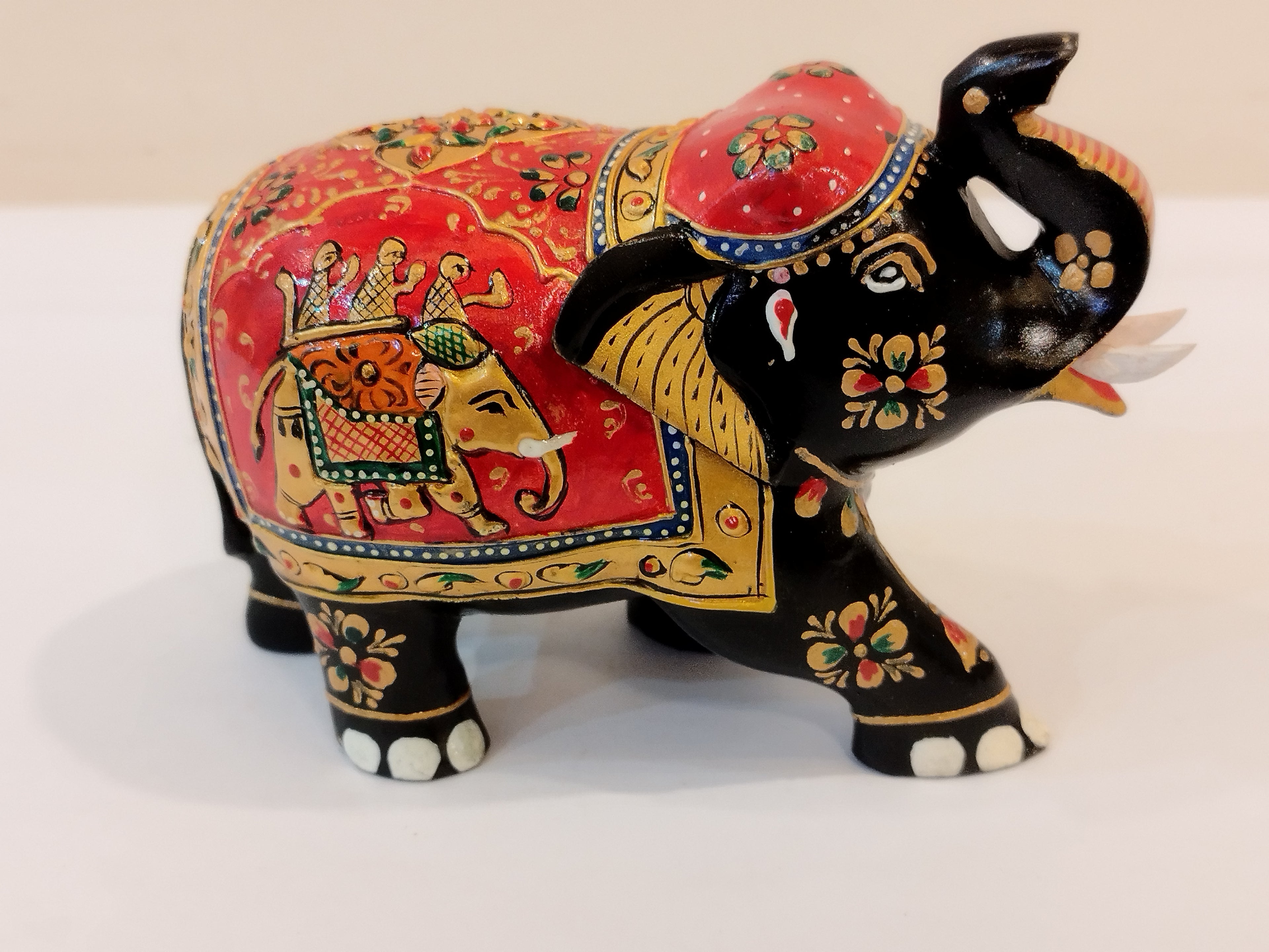 Handcrafted black kadam wood elephant painted statue-4 inches : strength, faith