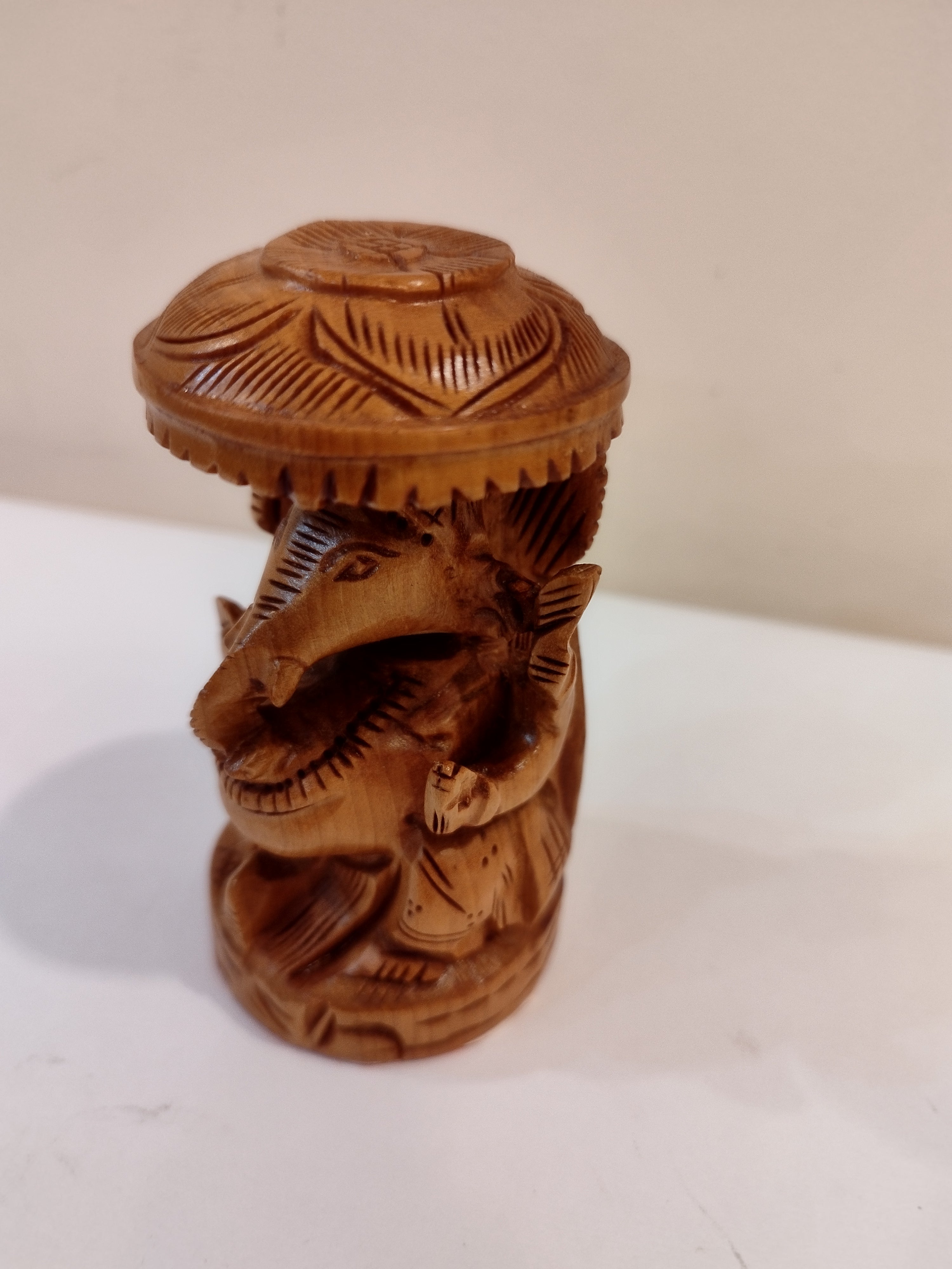 Hindu deity Vinayak, a handcrafted Kadam Wood Ganesha Statue with Chatari