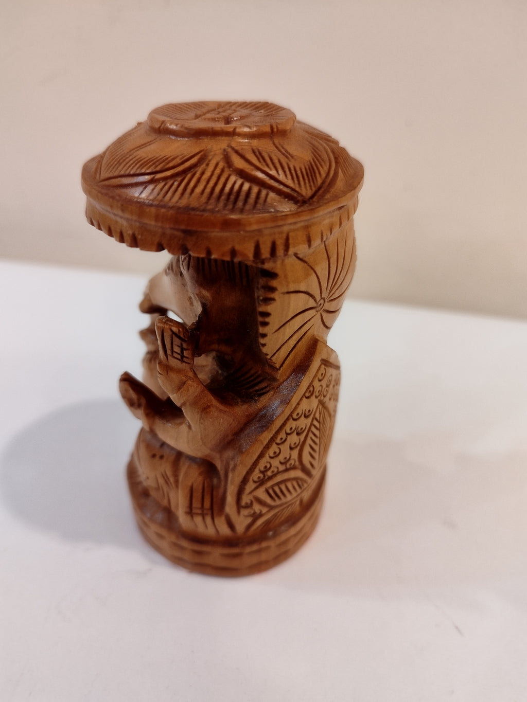 Hindu deity Vinayak, a handcrafted Kadam Wood Ganesha Statue with Chatari