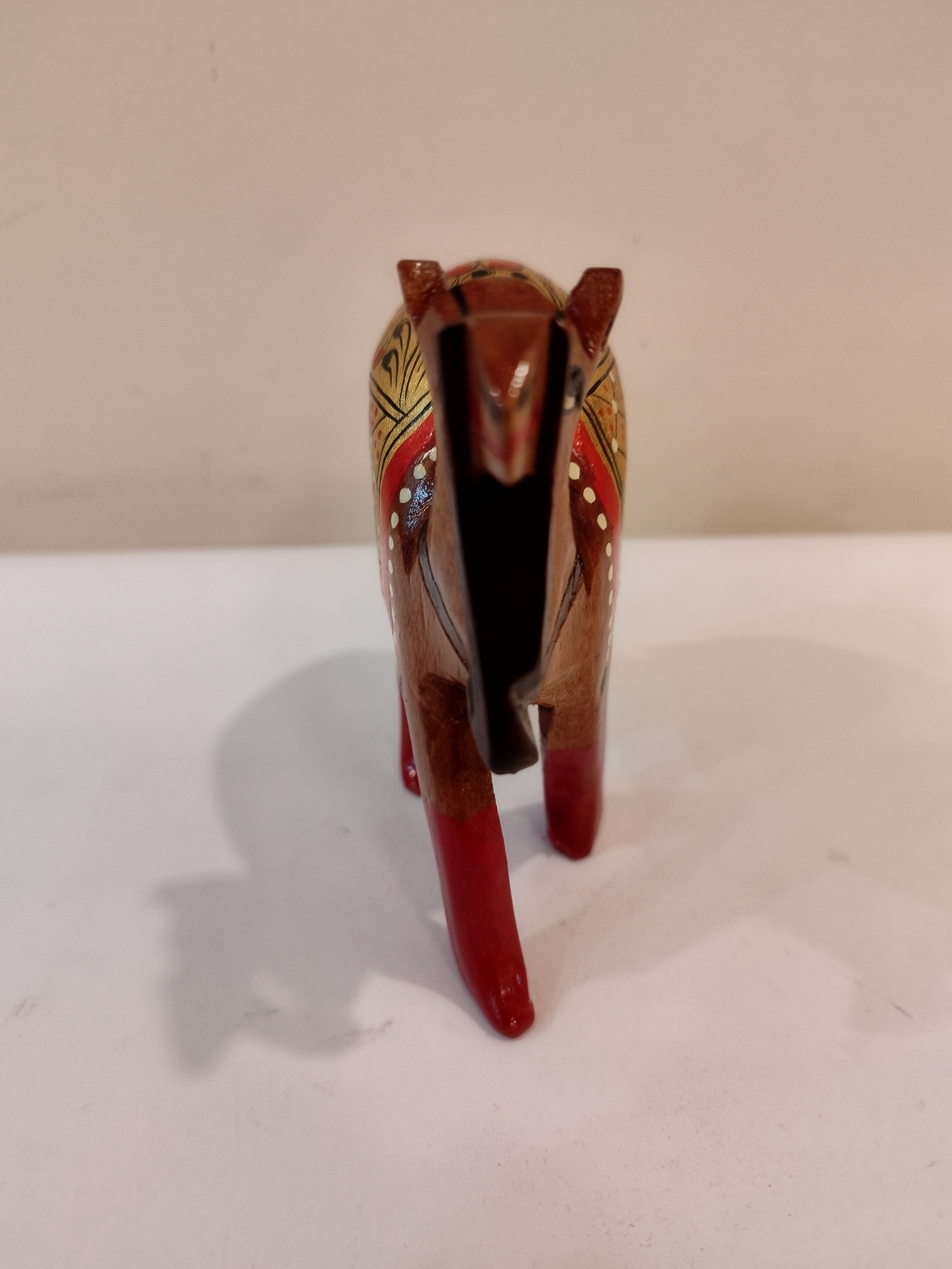 Hand Carved Camel painted in Kadam wood, height 4 inches. A desert animal for gifting.