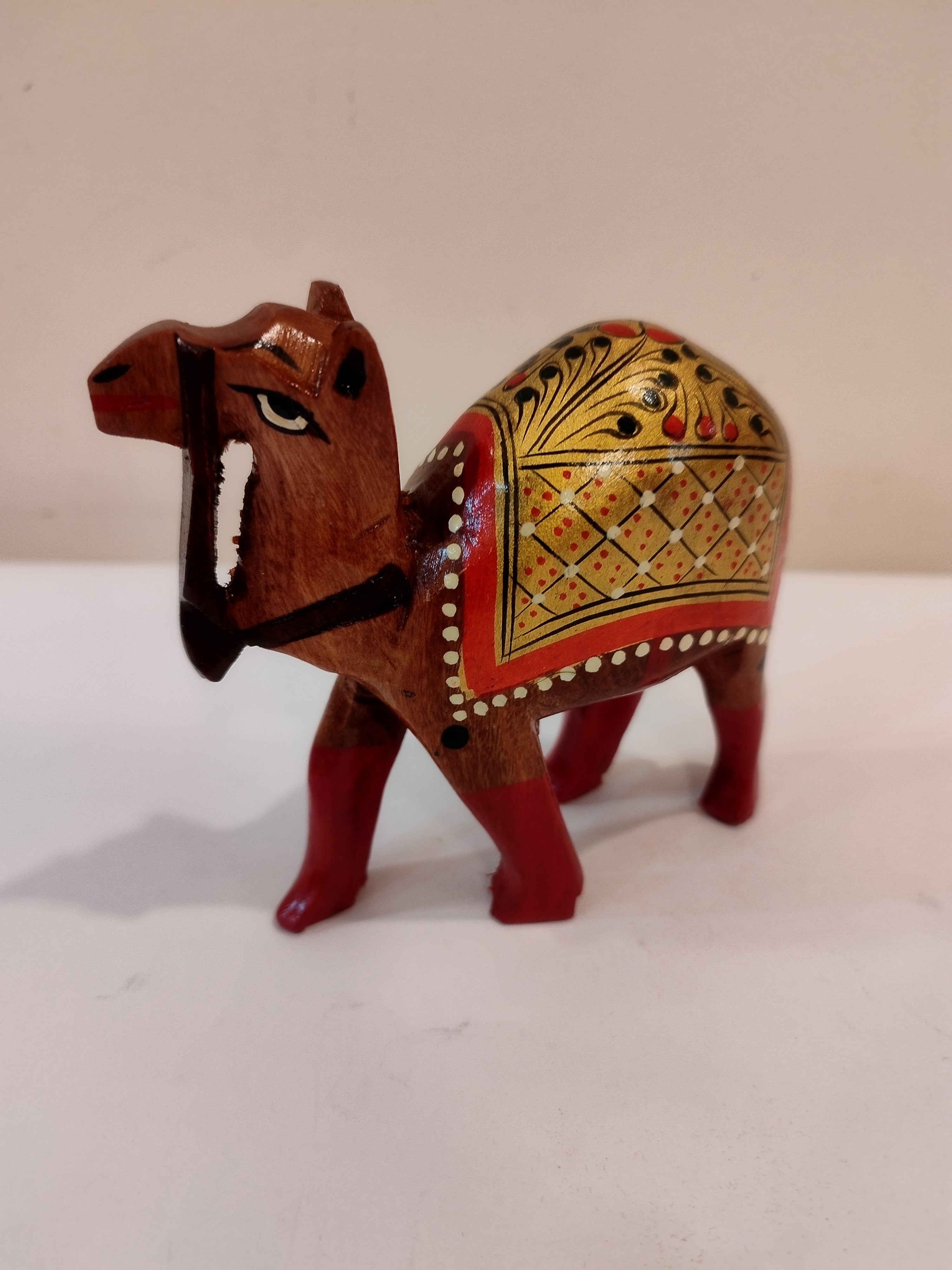 Hand Carved Camel painted in Kadam wood, height 4 inches. A desert animal for gifting.