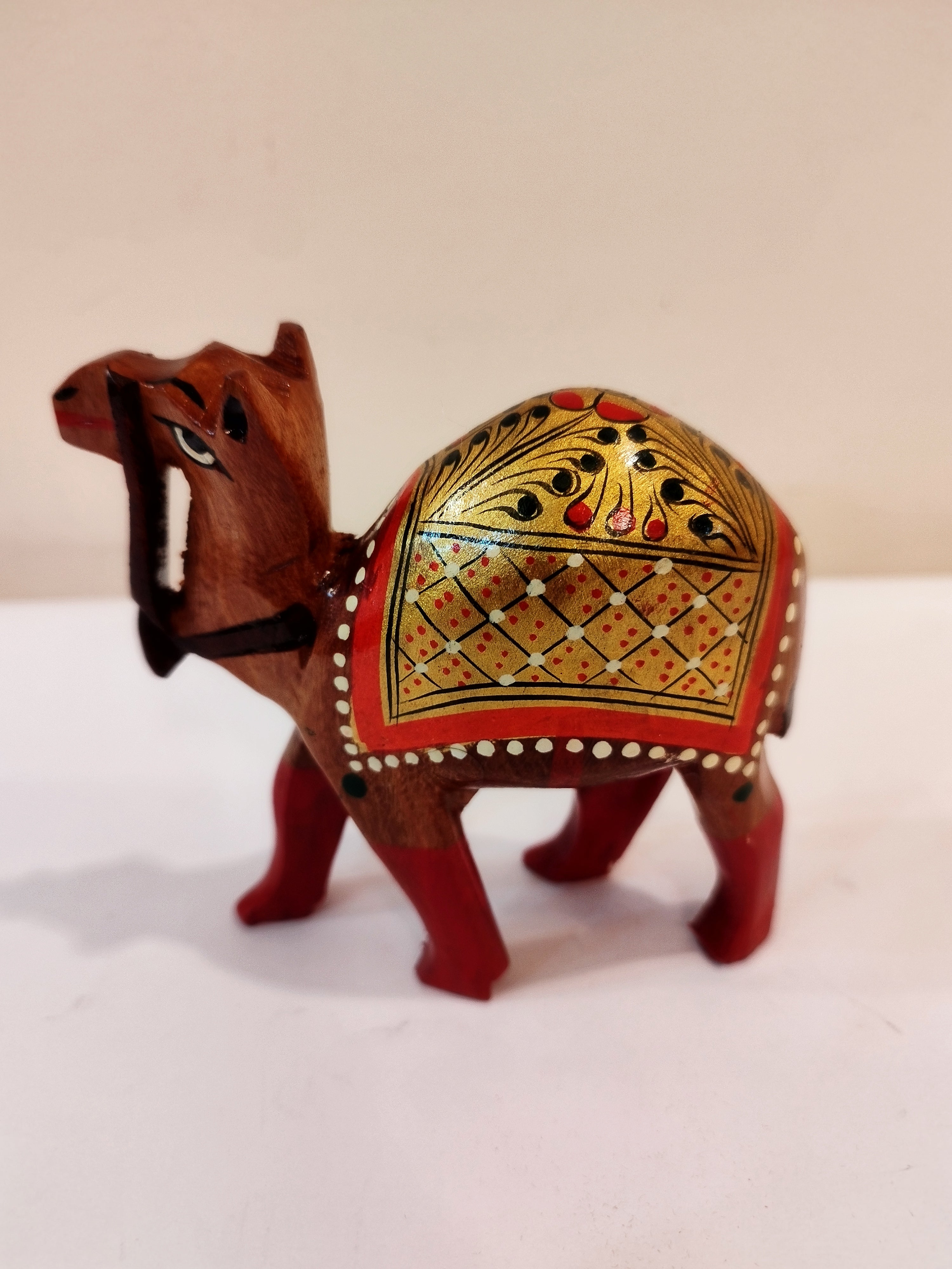 Hand Carved Camel painted in Kadam wood, height 4 inches. A desert animal for gifting.
