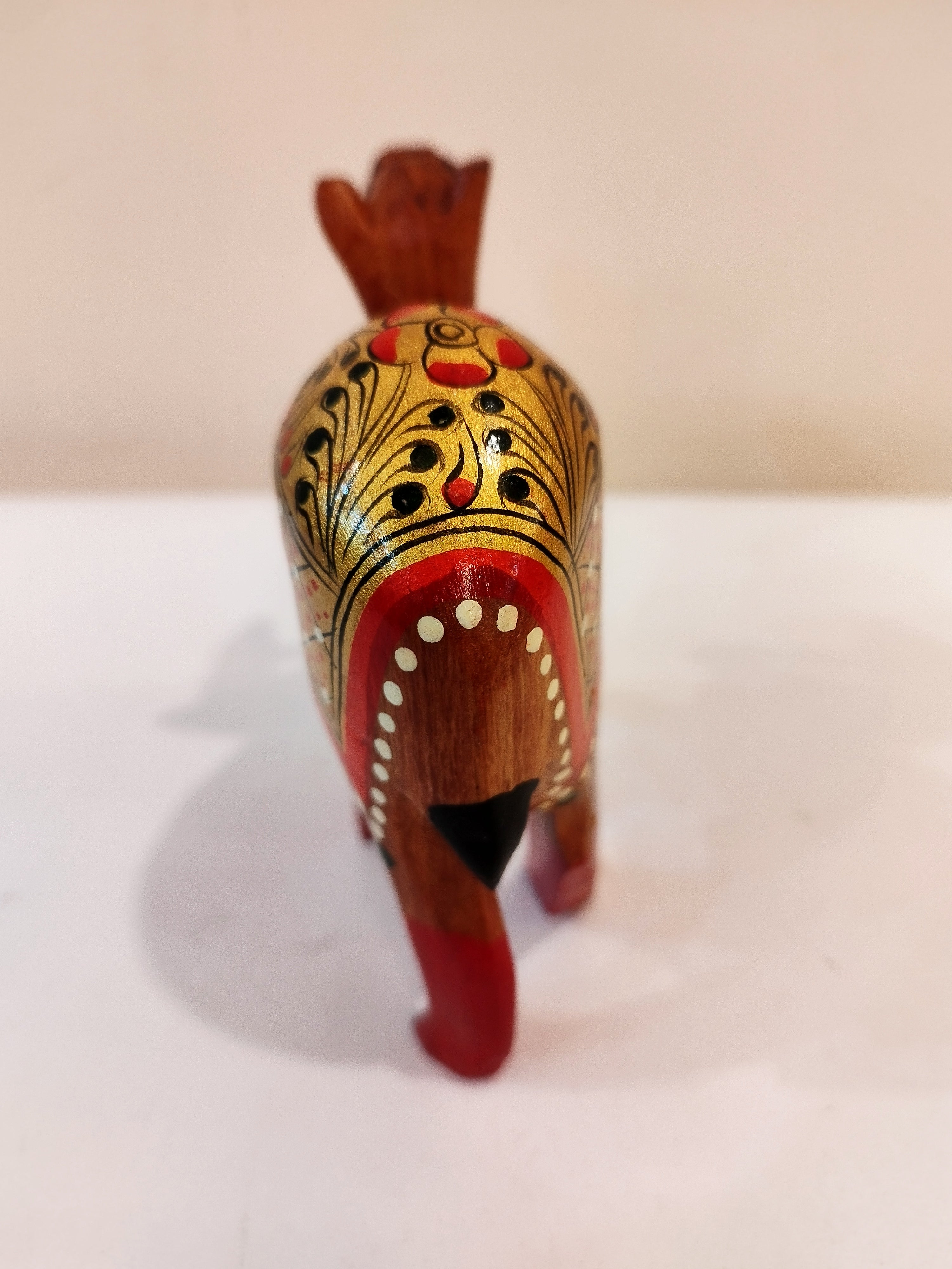 Hand Carved Camel painted in Kadam wood, height 4 inches. A desert animal for gifting.