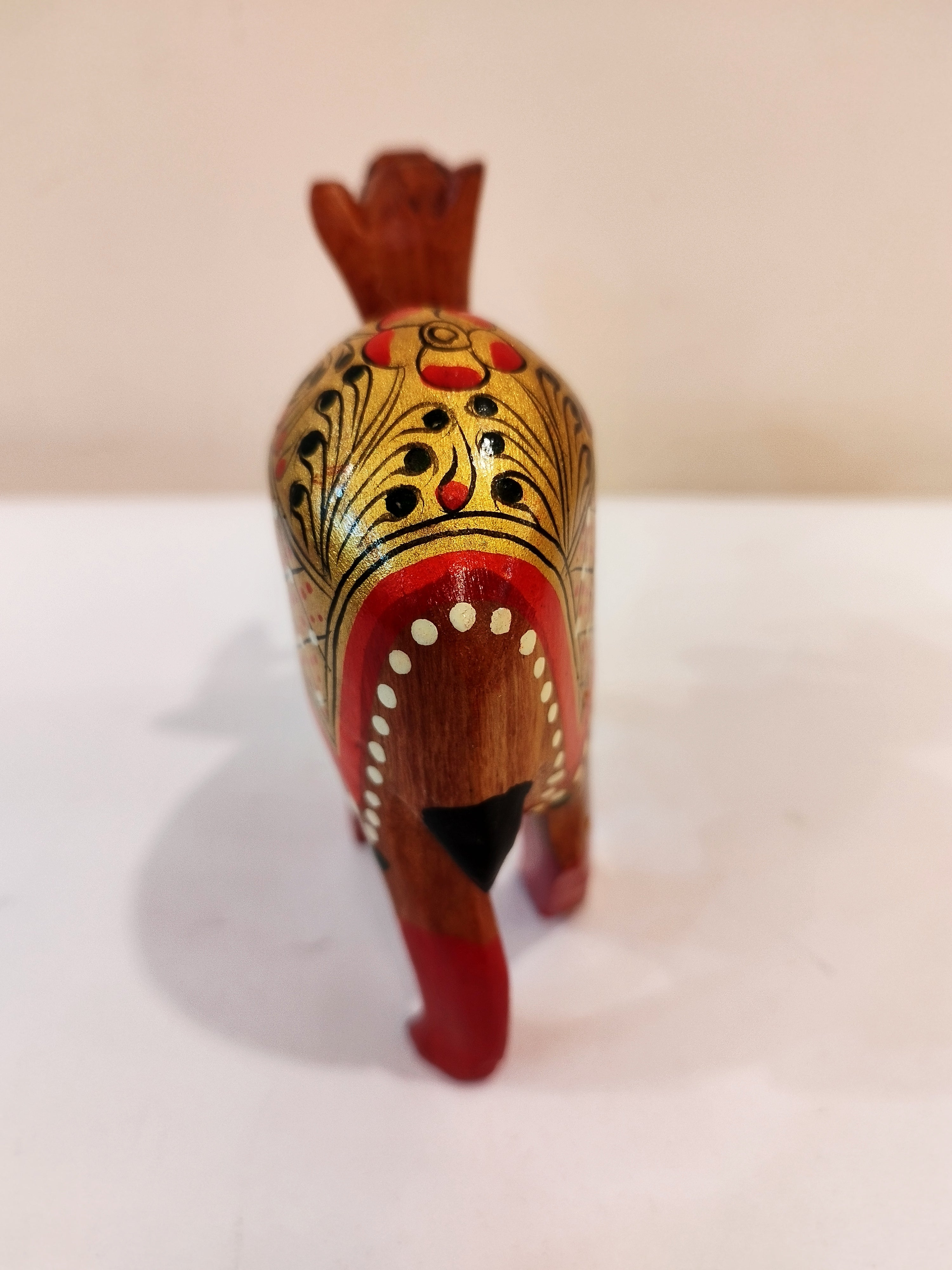 Hand Carved Camel painted in Kadam wood, height 4 inches. A desert animal for gifting.
