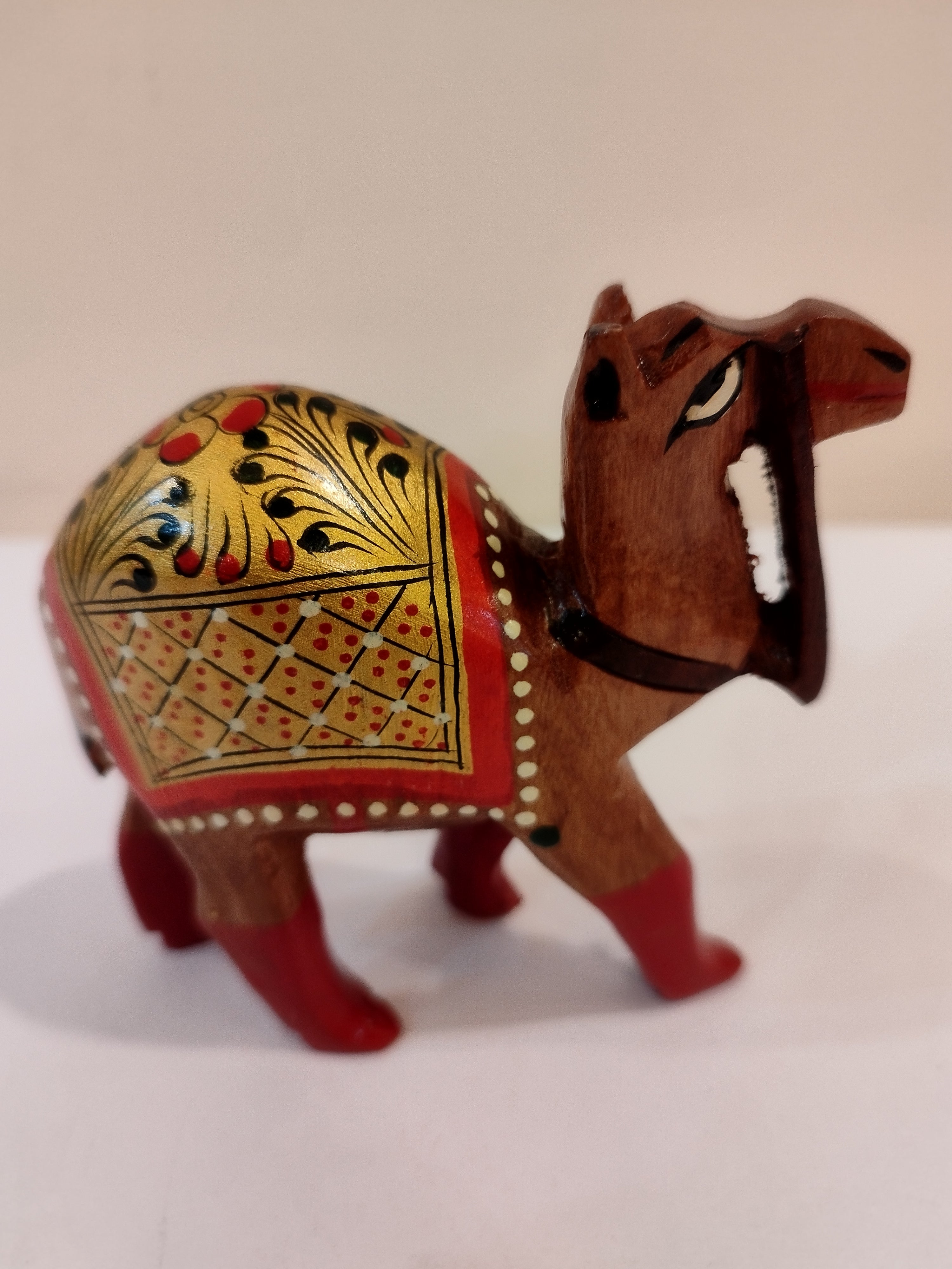 Hand Carved Camel painted in Kadam wood, height 4 inches. A desert animal for gifting.