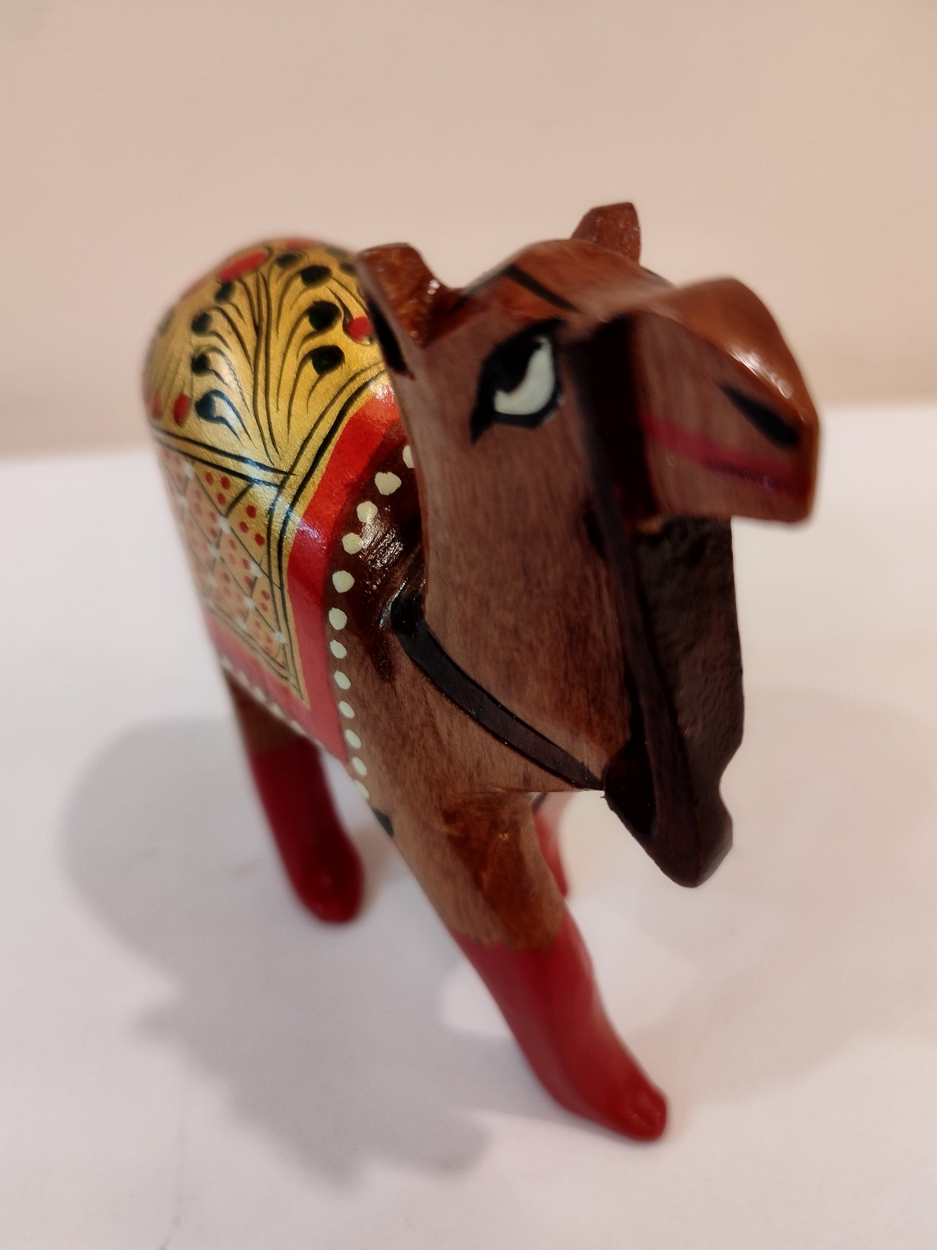 Hand Carved Camel painted in Kadam wood, height 4 inches. A desert animal for gifting.