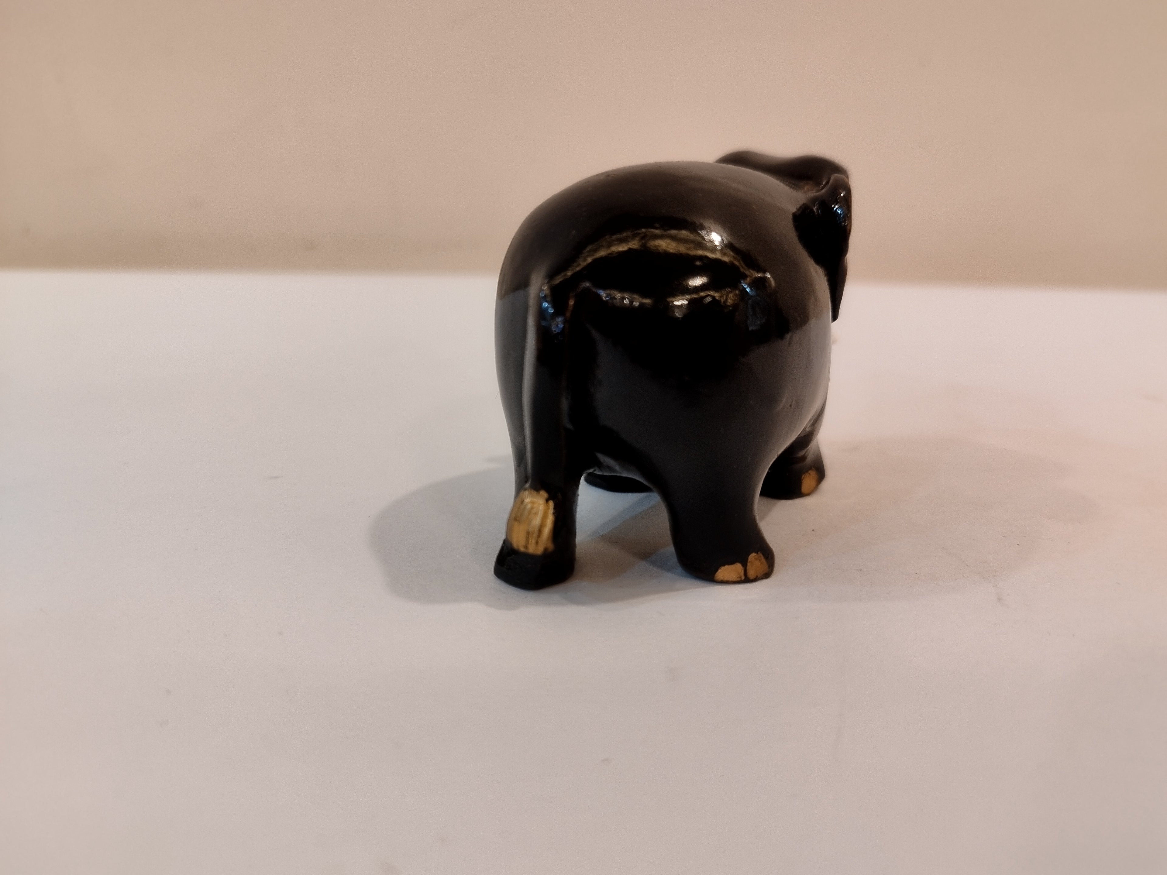 Handcrafted kadam wood black elephant statue  down trunk- 2 inches