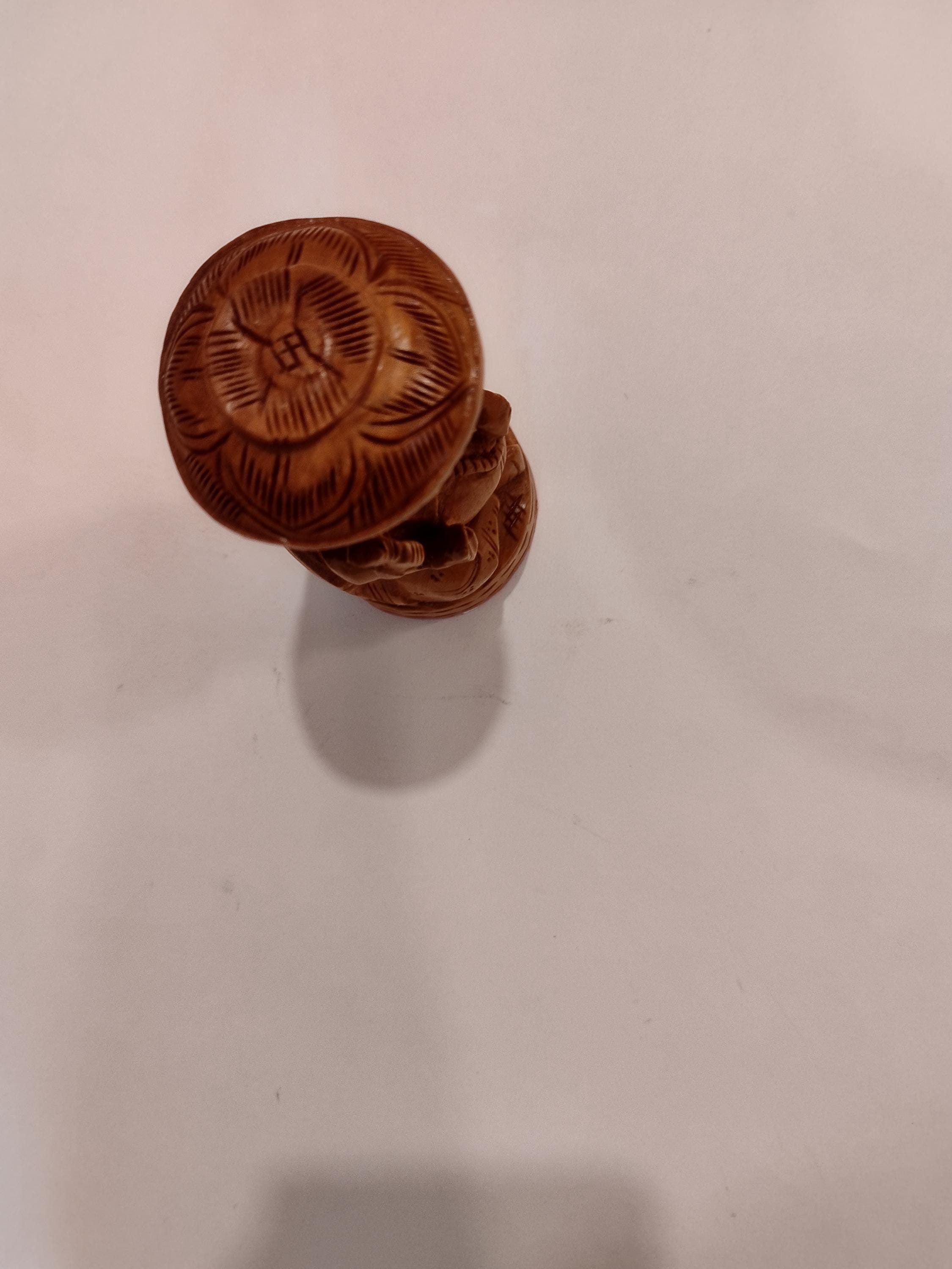 Hindu deity Vinayak, a handcrafted Kadam Wood Ganesha Statue with Chatari