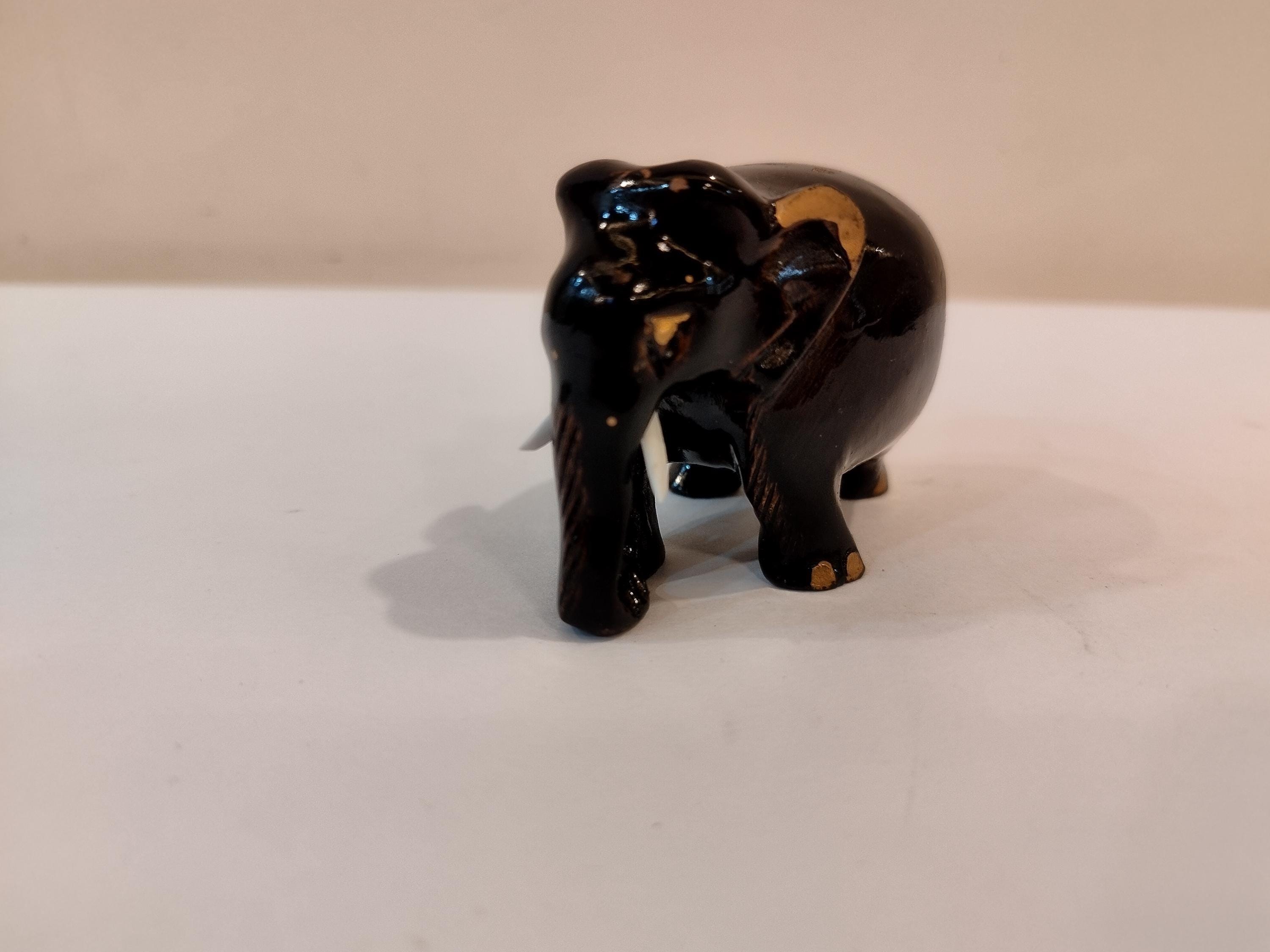 Handcrafted kadam wood black elephant statue  down trunk- 2 inches