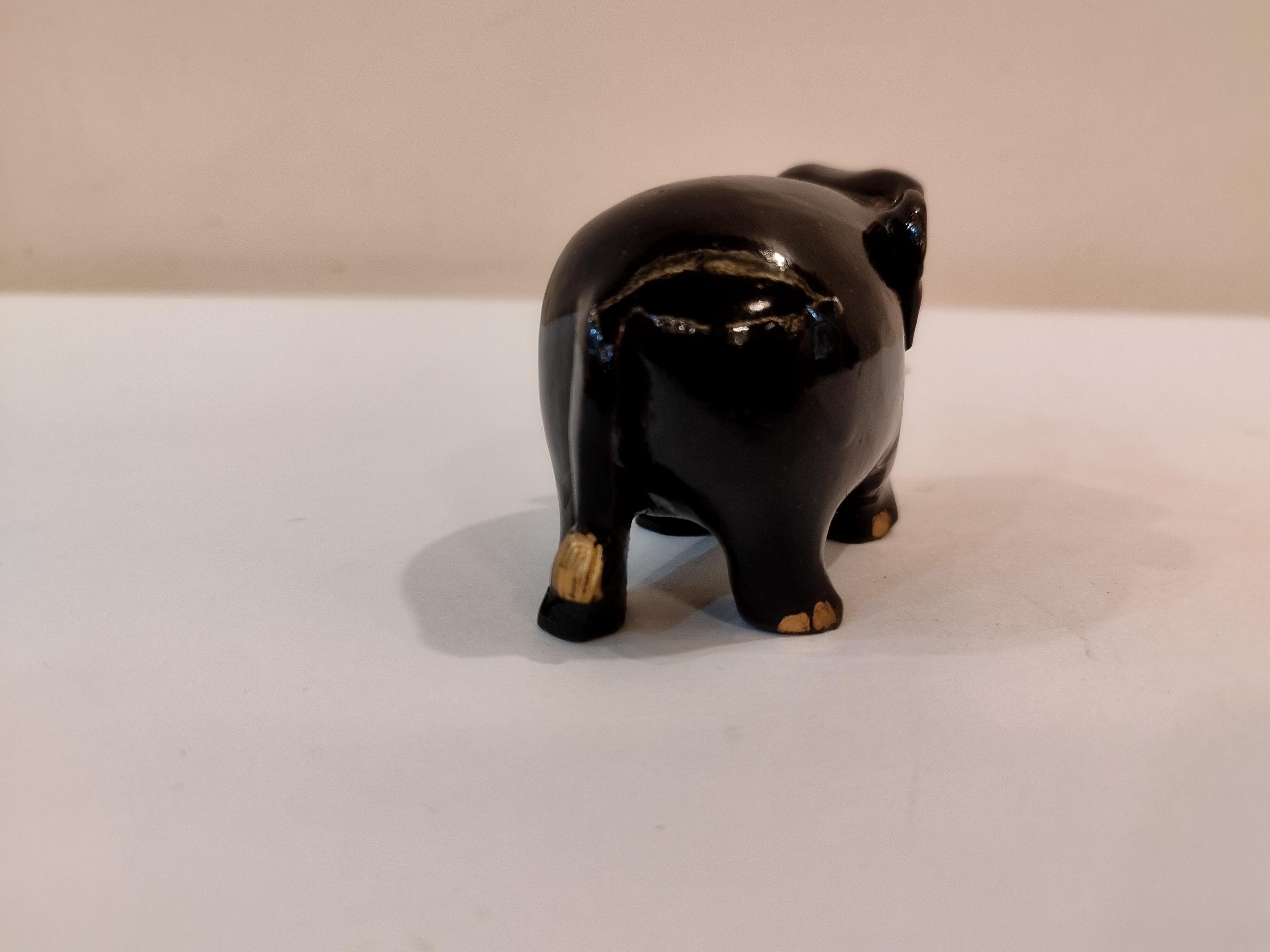 Handcrafted kadam wood black elephant statue  down trunk- 2 inches