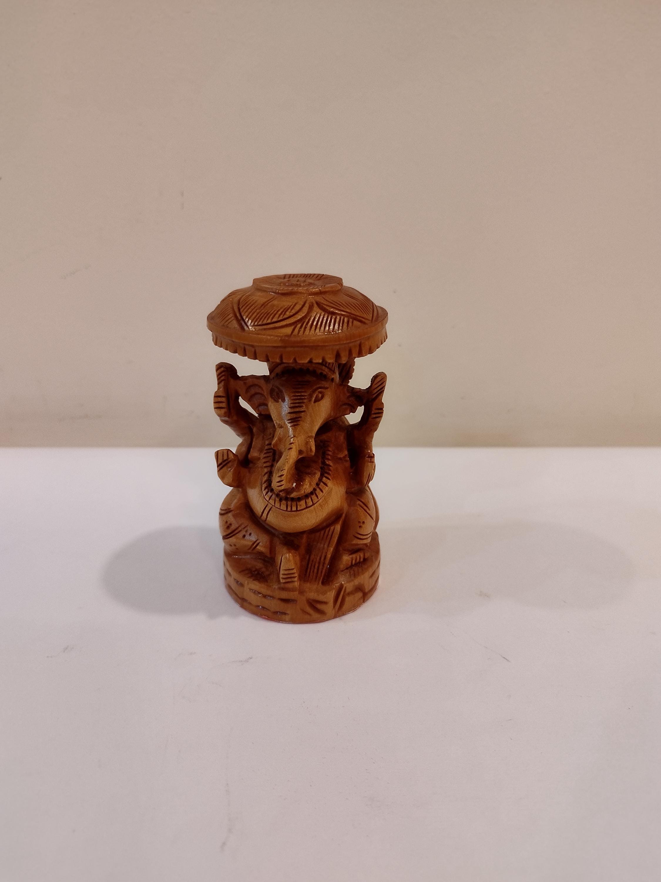 Hindu deity Vinayak, a handcrafted Kadam Wood Ganesha Statue with Chatari
