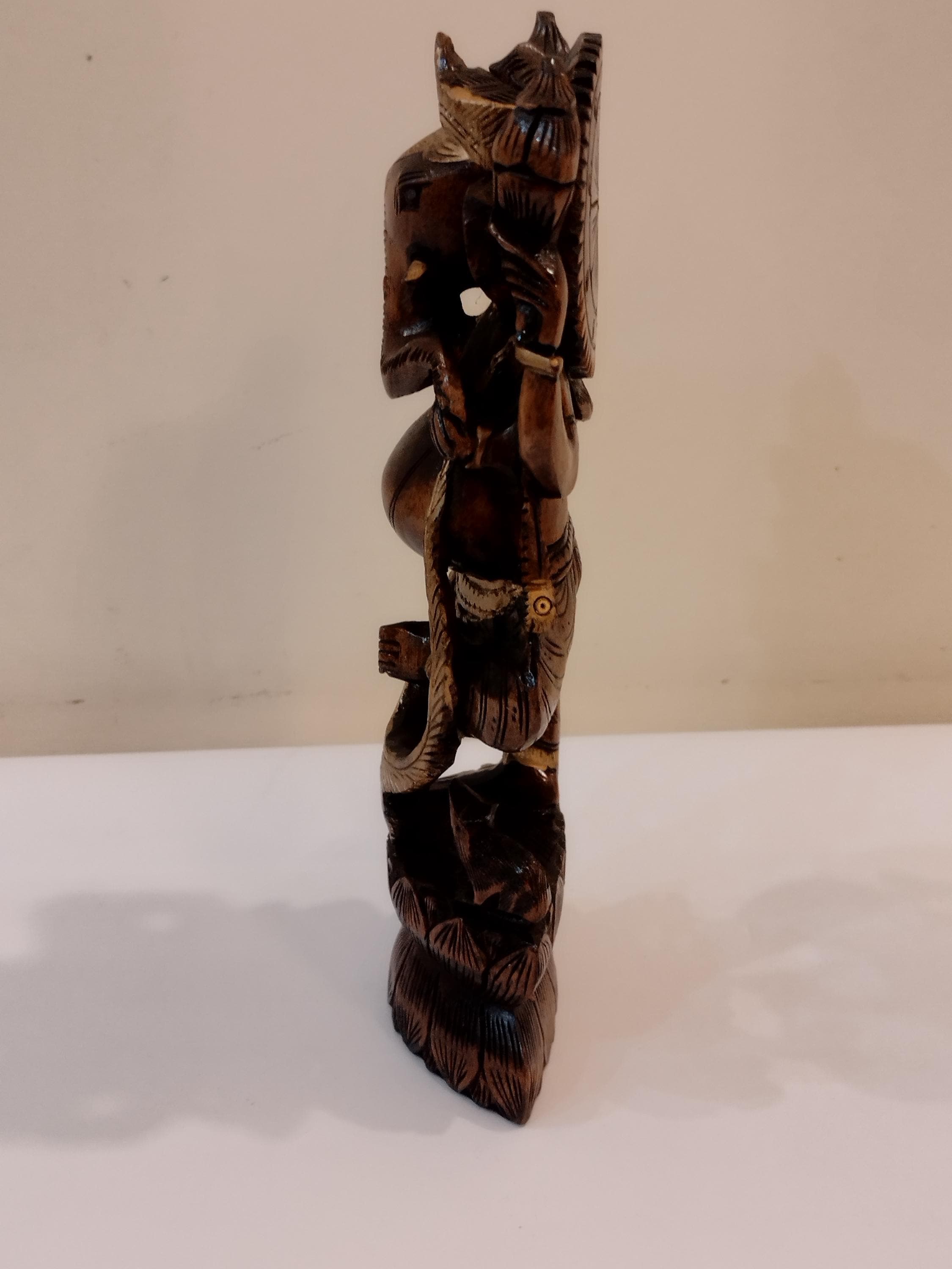 Hindu deity Vinayak, a handcrafted Kadam Wood Dancing Ganesha Statue