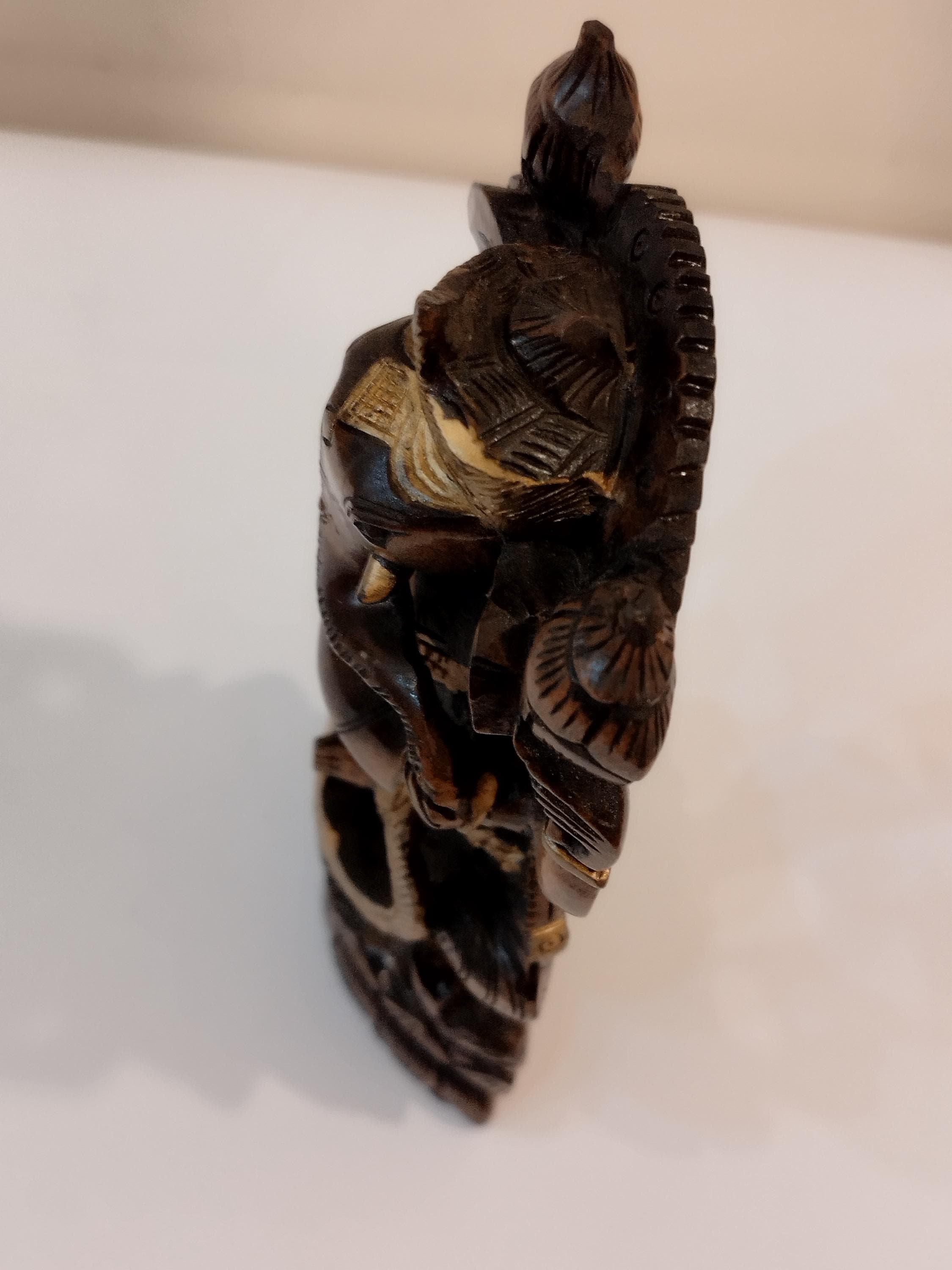 Hindu deity Vinayak, a handcrafted Kadam Wood Dancing Ganesha Statue