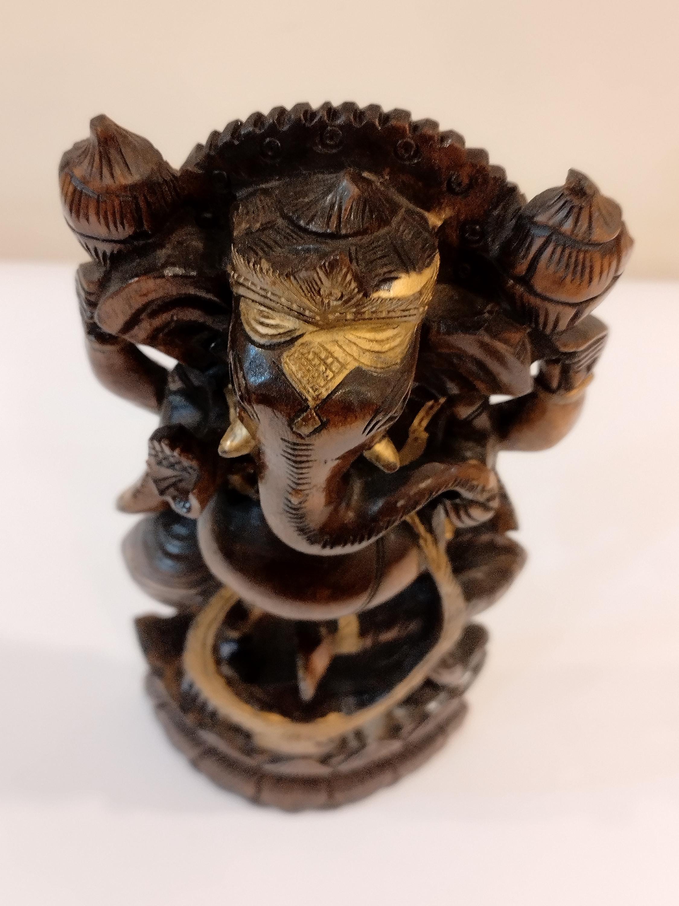 Hindu deity Vinayak, a handcrafted Kadam Wood Dancing Ganesha Statue