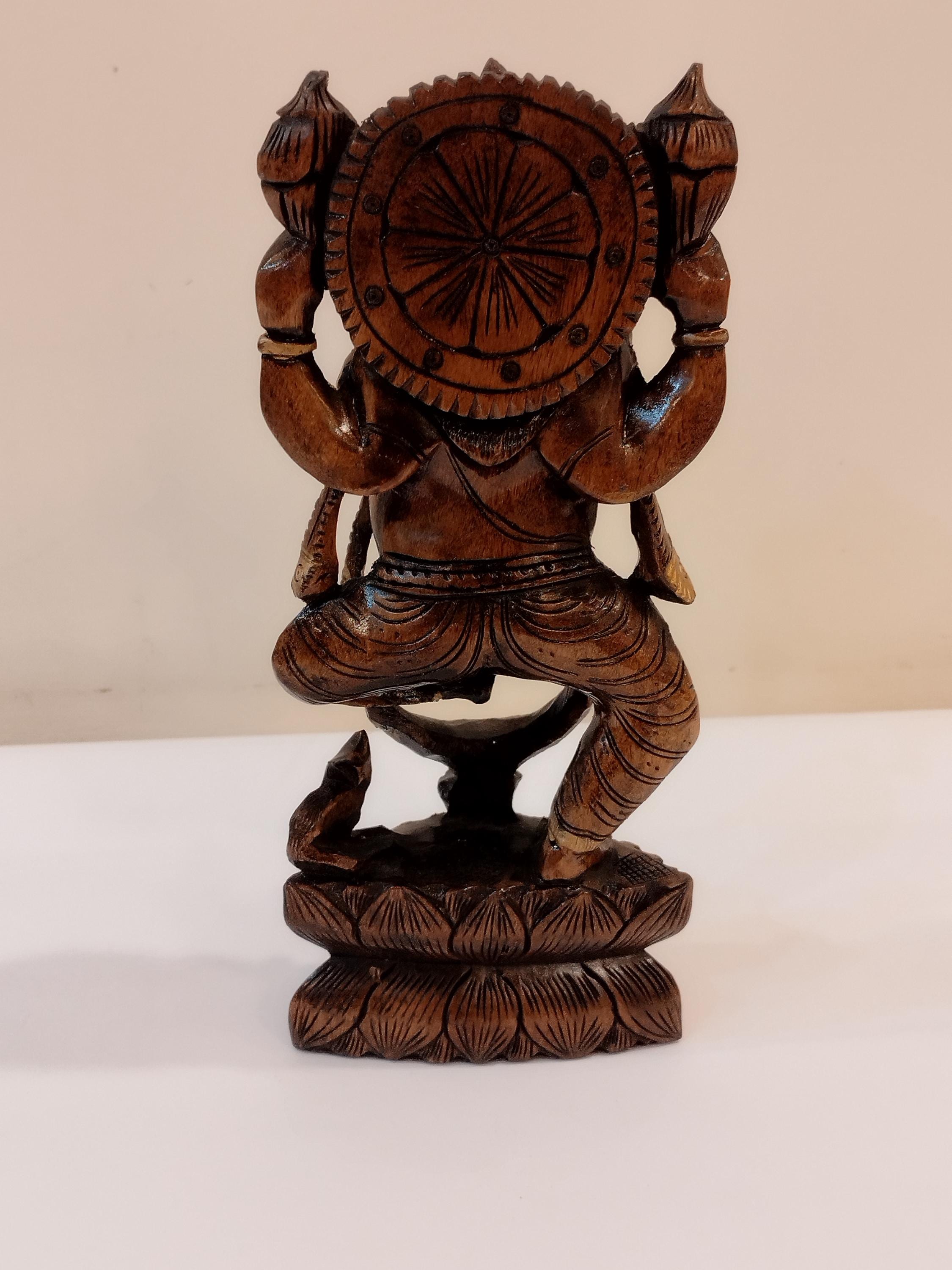 Hindu deity Vinayak, a handcrafted Kadam Wood Dancing Ganesha Statue
