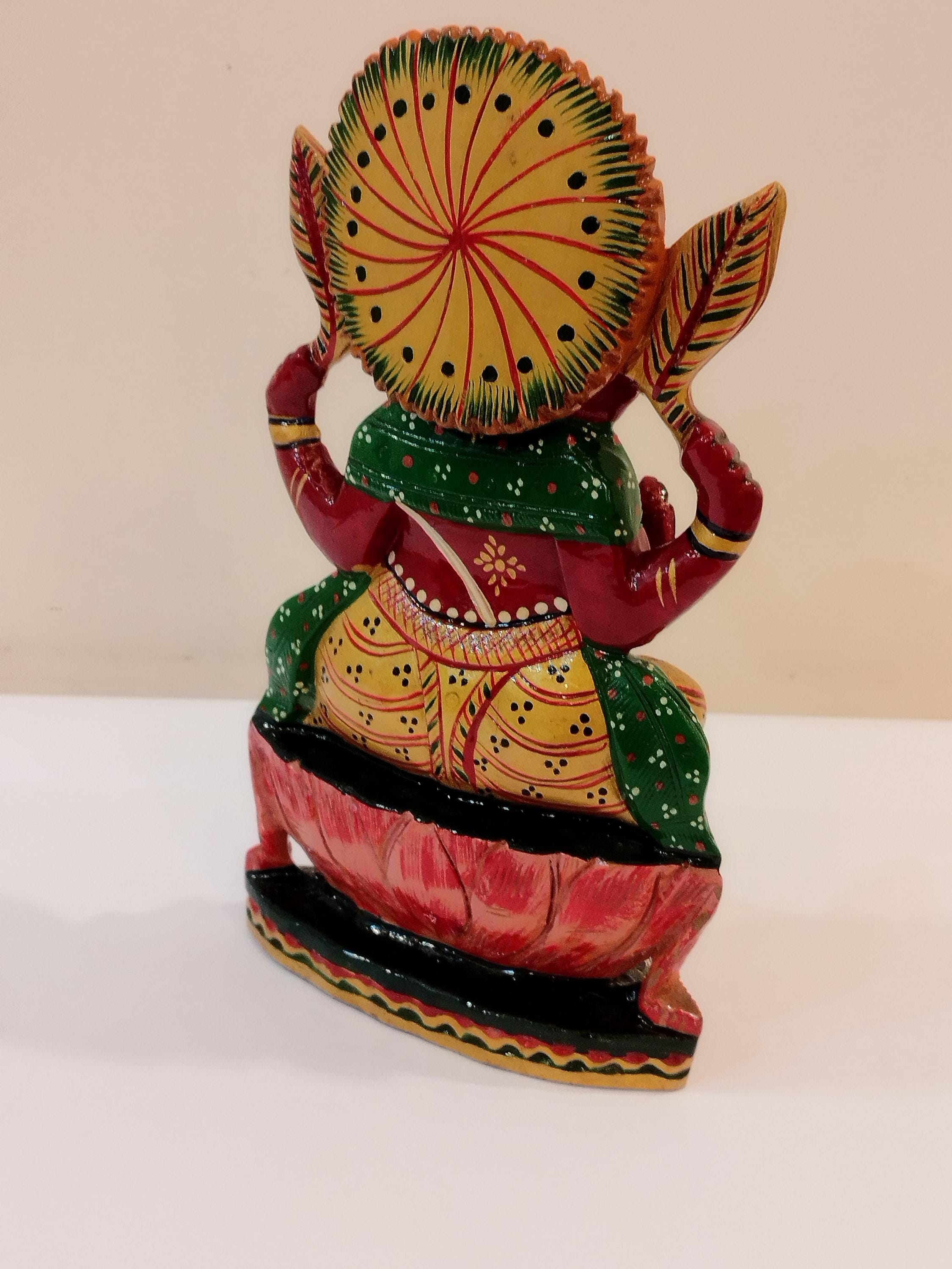Hindu deity Vinayak, a handcrafted Kadam Wood Painted Ganesha Statue with Chatar (8 inches)