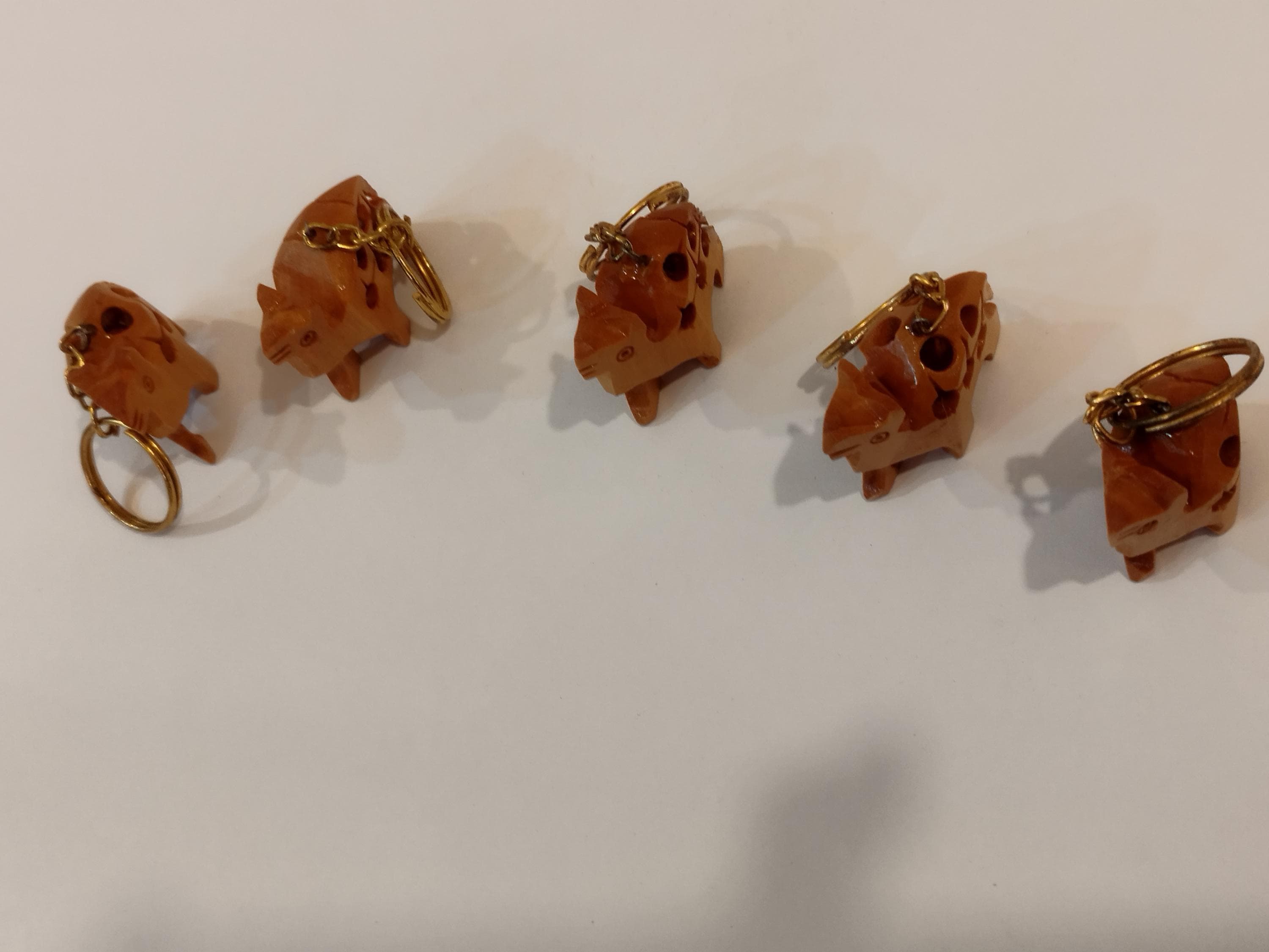 Hand carved camel kadam wood key chain set of 5: a desert animal for gifting.