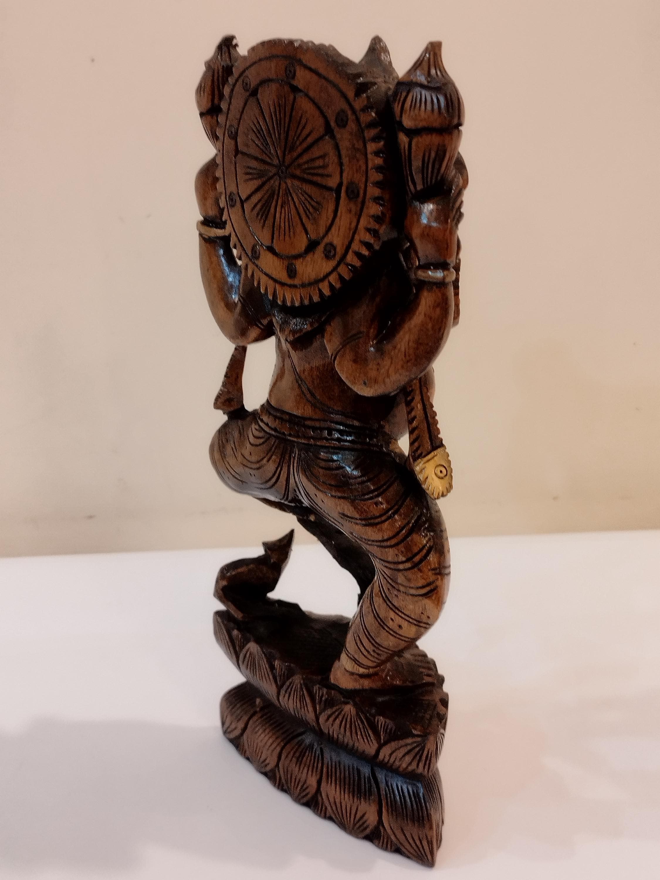 Hindu deity Vinayak, a handcrafted Kadam Wood Dancing Ganesha Statue