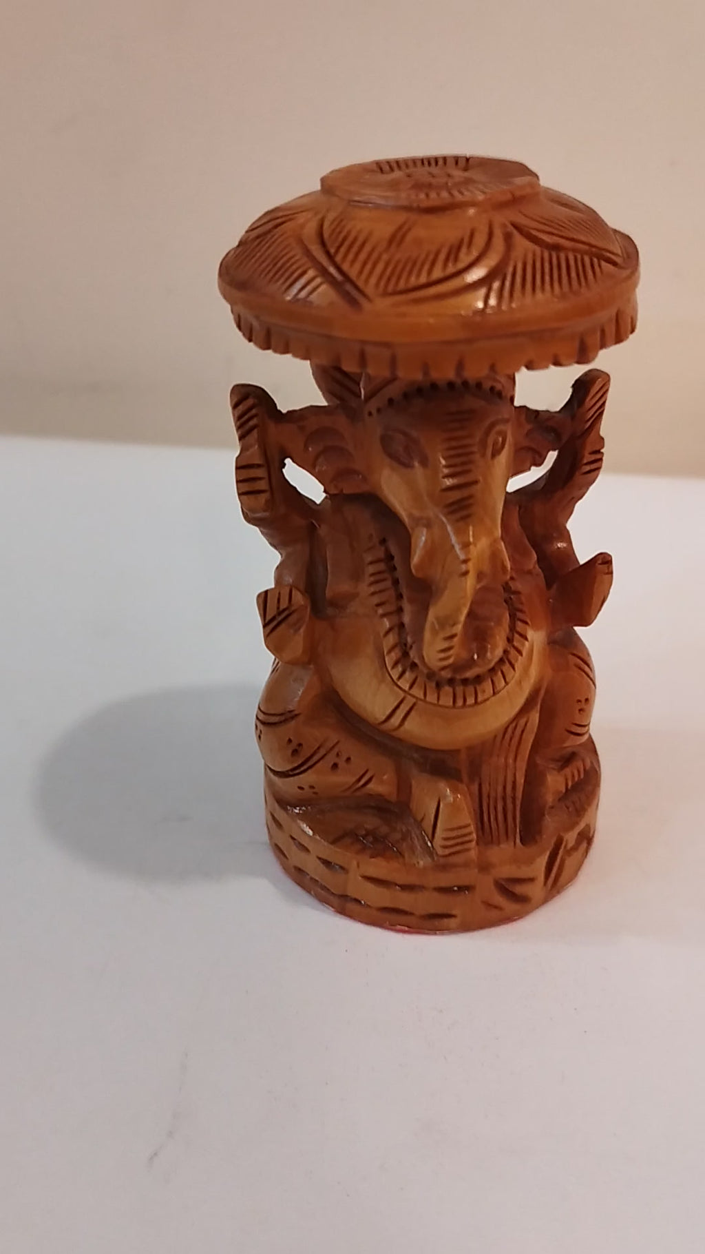 Hindu deity Vinayak, a handcrafted Kadam Wood Ganesha Statue with Chatari