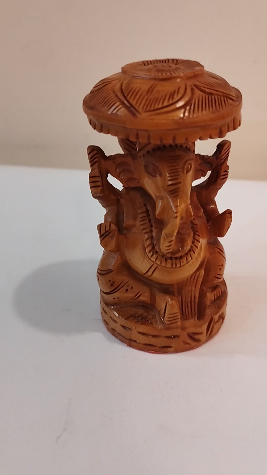 Hindu deity Vinayak, a handcrafted Kadam Wood Ganesha Statue with Chatari