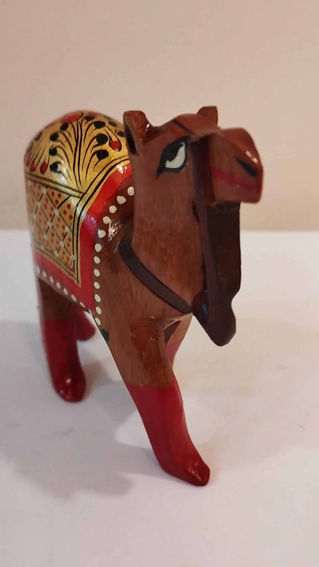 Hand Carved Camel painted in Kadam wood, height 4 inches. A desert animal for gifting.