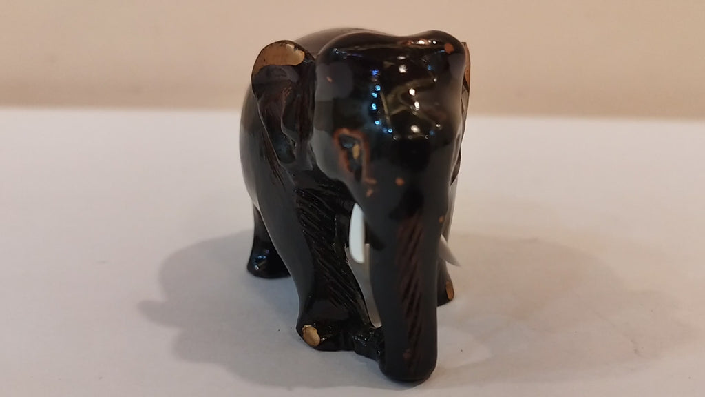 Handcrafted kadam wood black elephant statue  down trunk- 2 inches